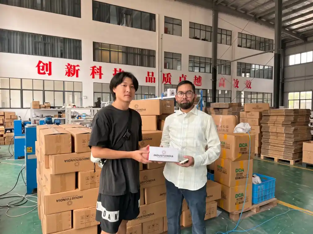 Customer visit photo in the workshop beside packed goods